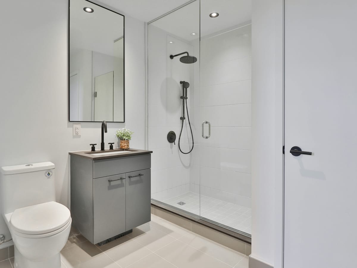 Renovated bathroom with a glass shower and floating vanity